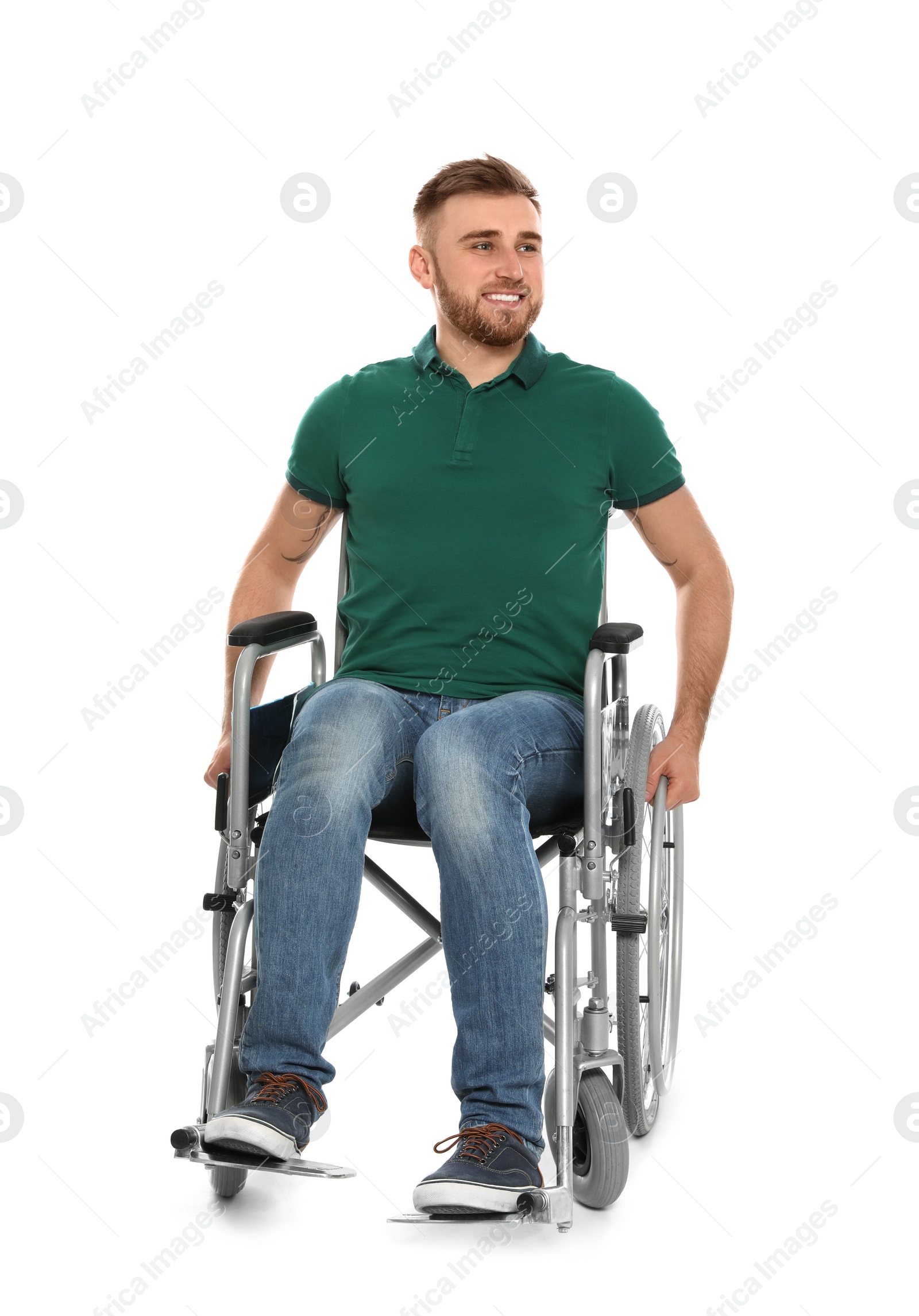 Photo of Handsome young man in wheelchair isolated on white