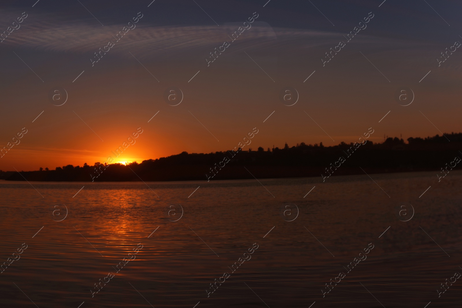 Photo of Picturesque view of beautiful sunset on riverside