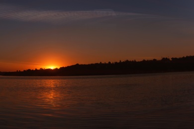 Photo of Picturesque view of beautiful sunset on riverside