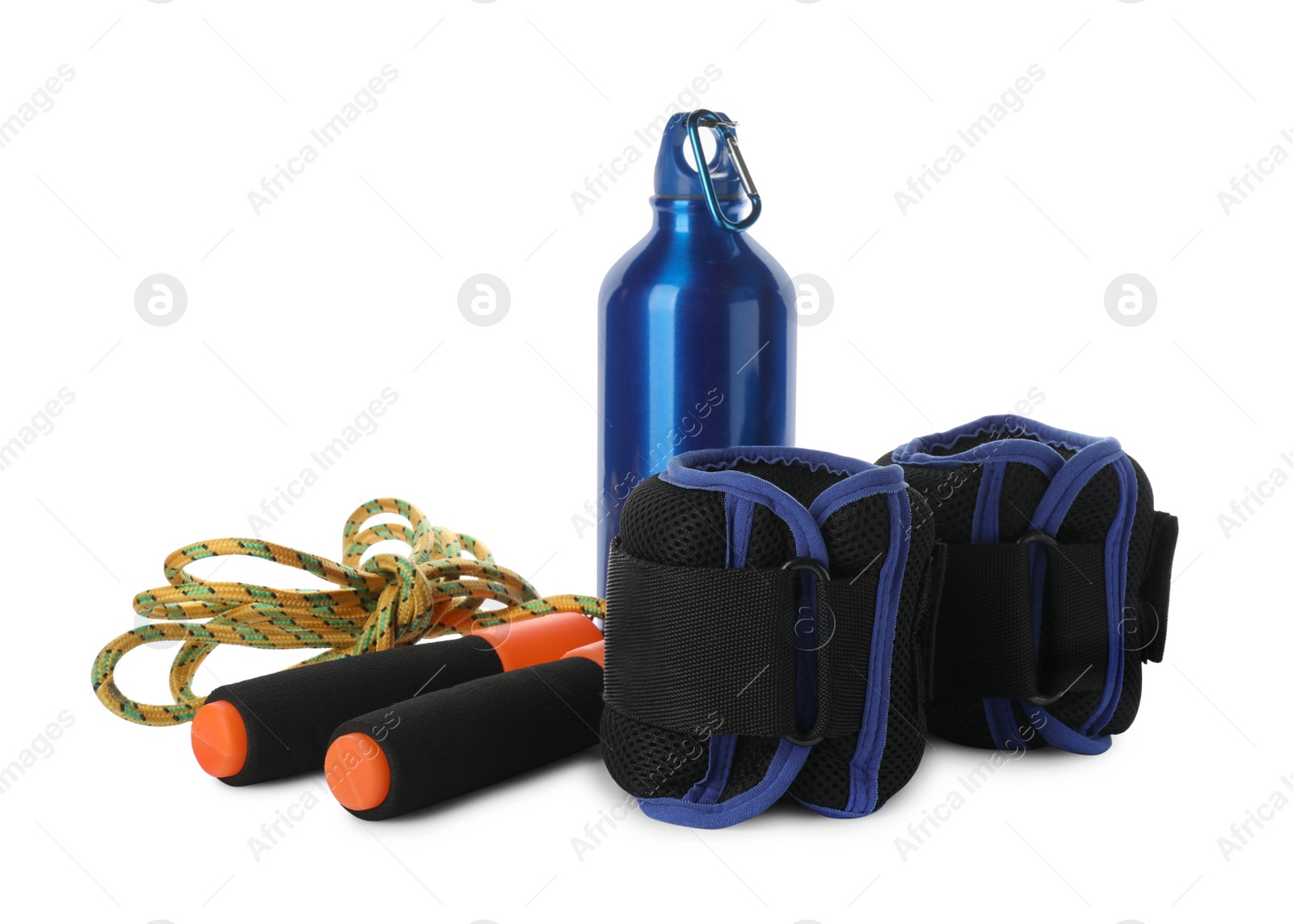 Photo of Stylish weighting agents, skipping rope and sport bottle on white background