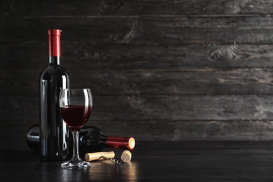 Photo of Composition with delicious red wine on wooden table