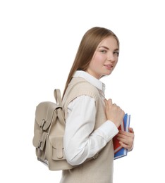 Photo of Teenage student with backpack and books on white background
