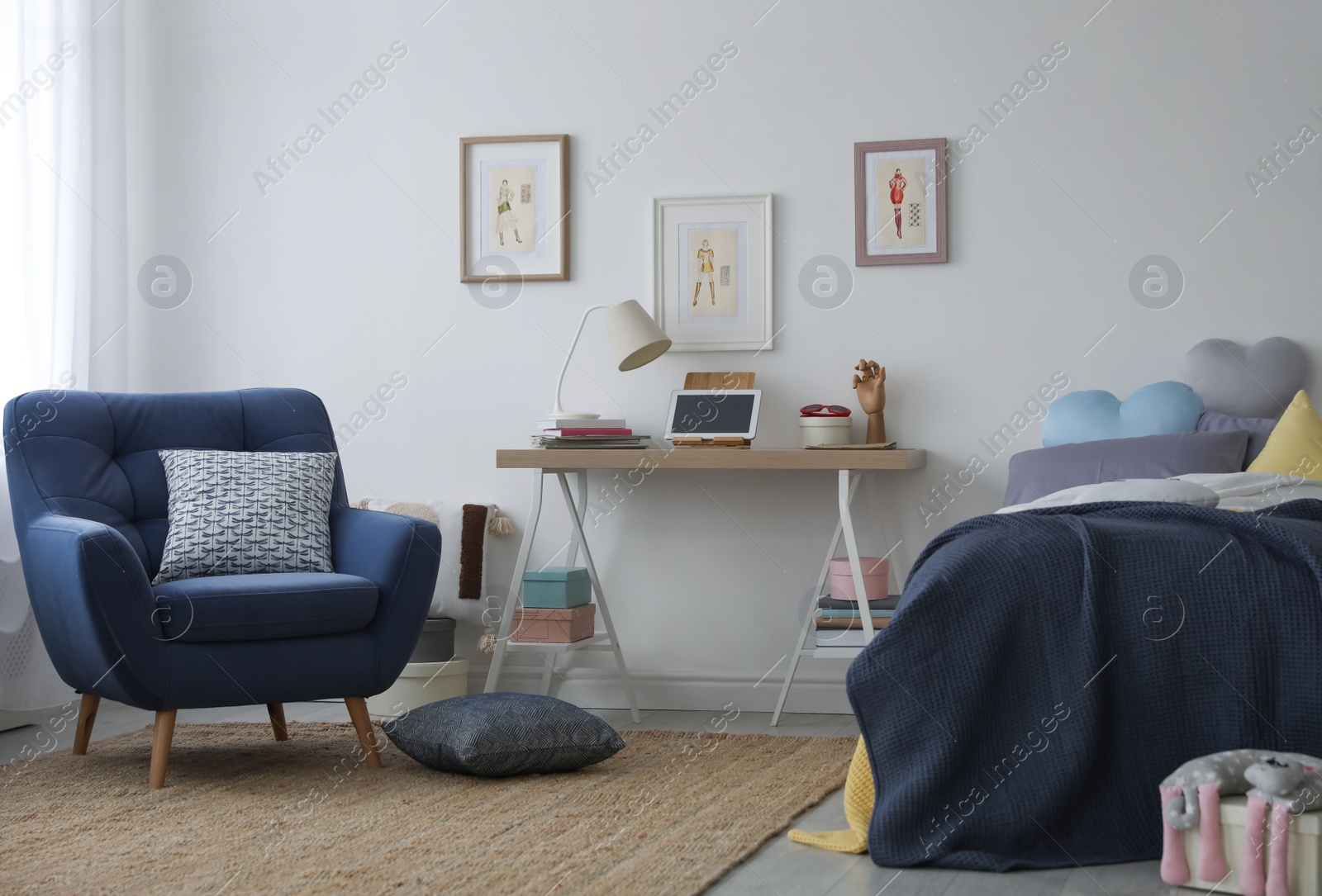 Photo of Modern teenager's room interior with bed and armchair