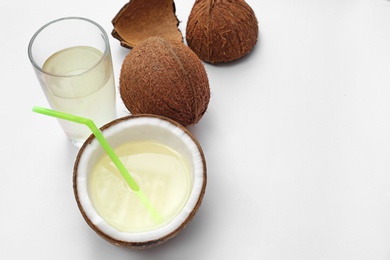 Photo of Composition with coconuts and drink on white background