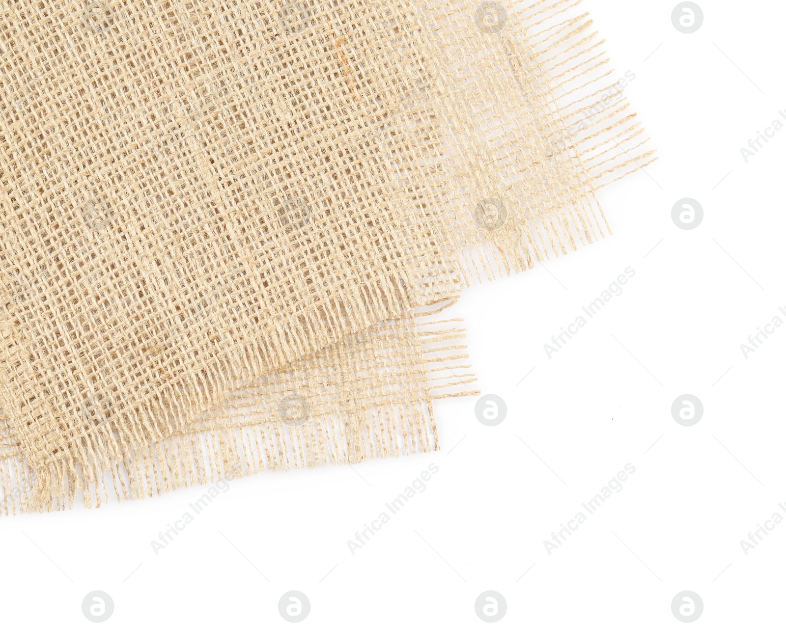 Photo of Pieces of burlap fabric isolated on white, top view