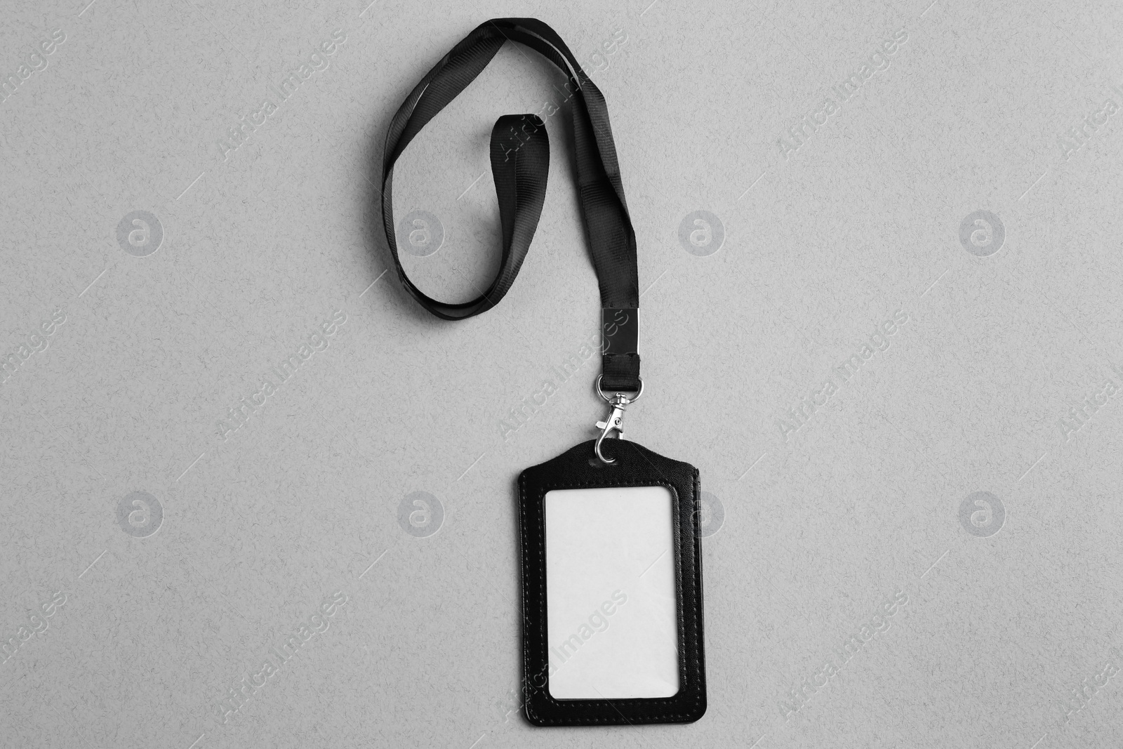 Photo of Blank badge on light grey background, top view. Mockup for design