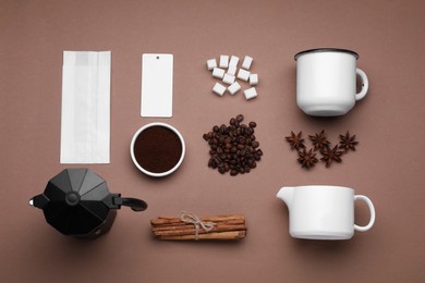 Flat lay composition with geyser coffee maker and roasted beans on brown background