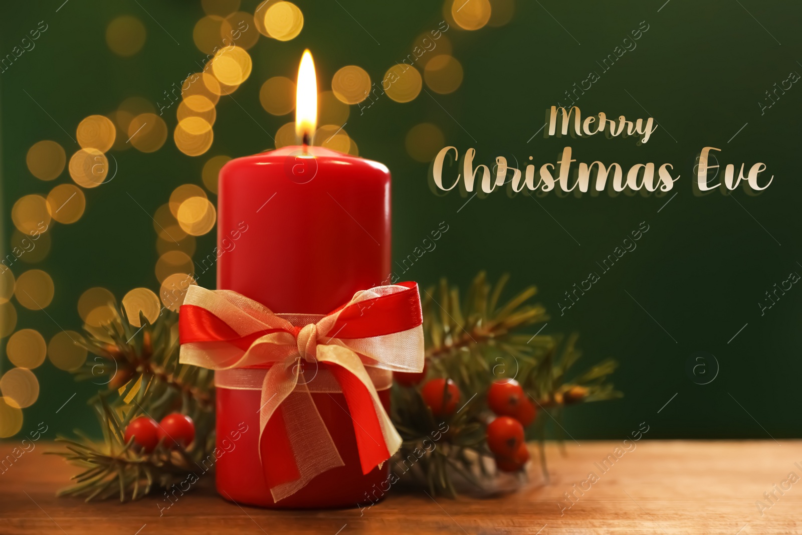 Image of Merry Christmas Eve, postcard design. Beautiful composition with burning candle on wooden table against blurred lights 