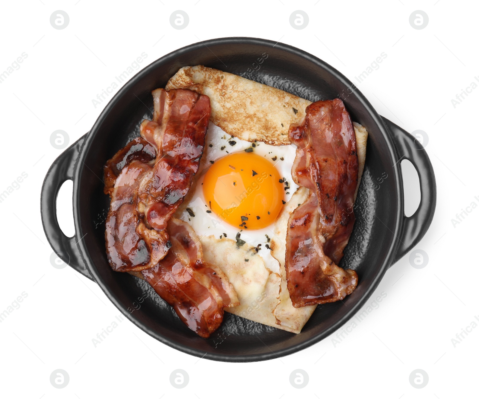 Photo of Delicious crepe with egg isolated on white, top view. Breton galette