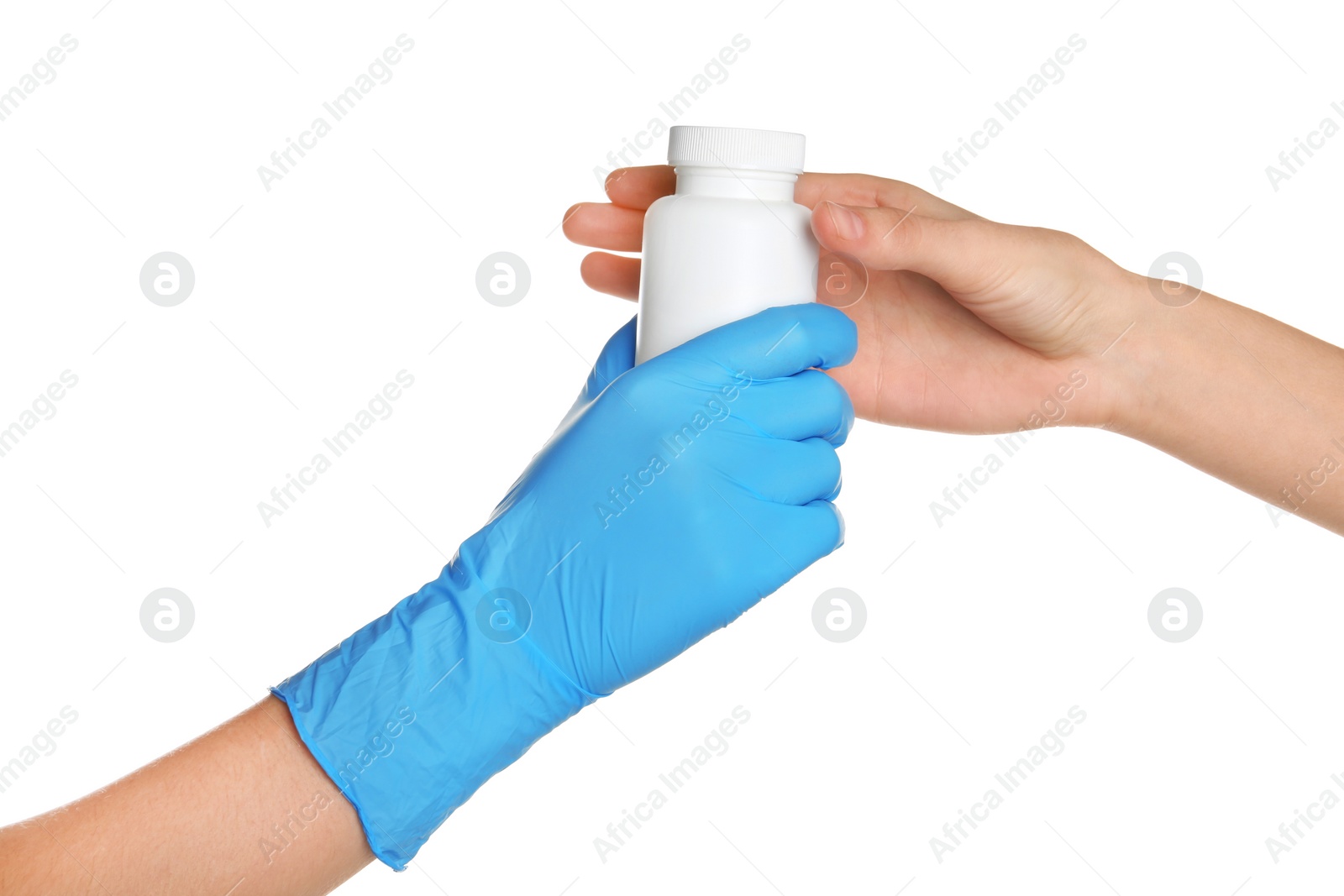 Photo of Doctor in medical glove giving bottle of pills to patient on white background