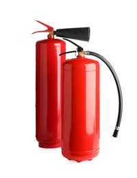 Photo of Two red fire extinguishers on white background