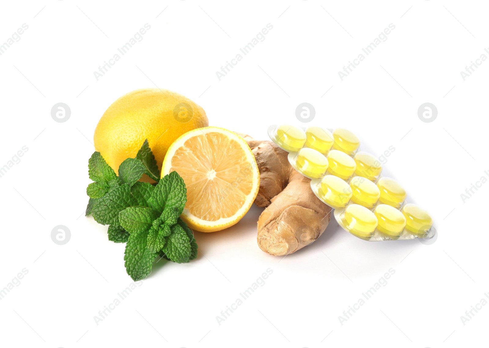 Photo of Cough candies, ginger, mint and lemons on white background