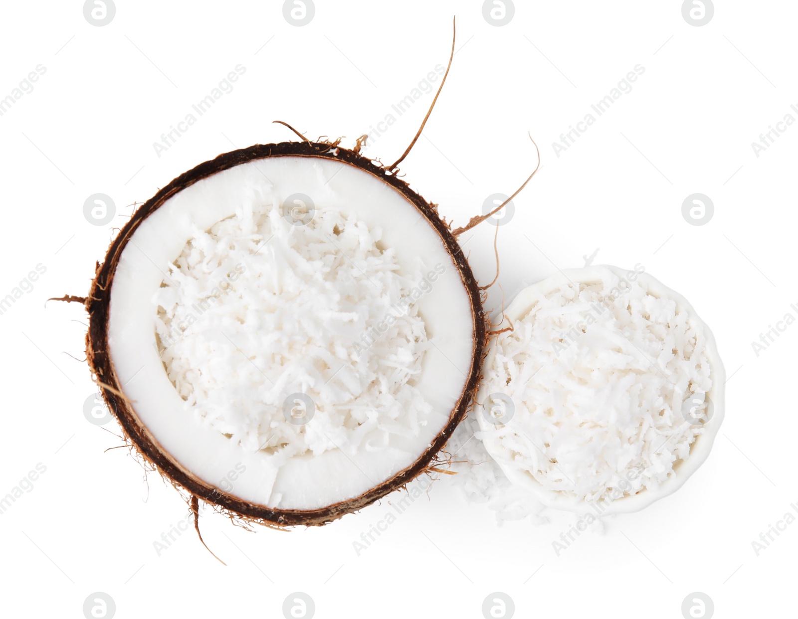 Photo of Coconut flakes and nut isolated on white, top view