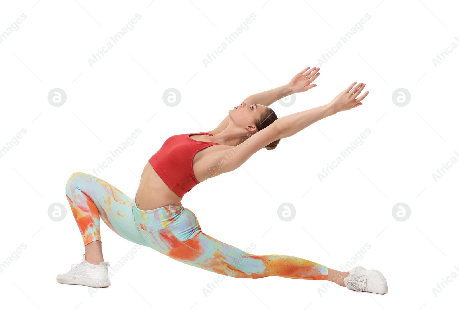 Photo of Yoga workout. Young woman stretching on white background