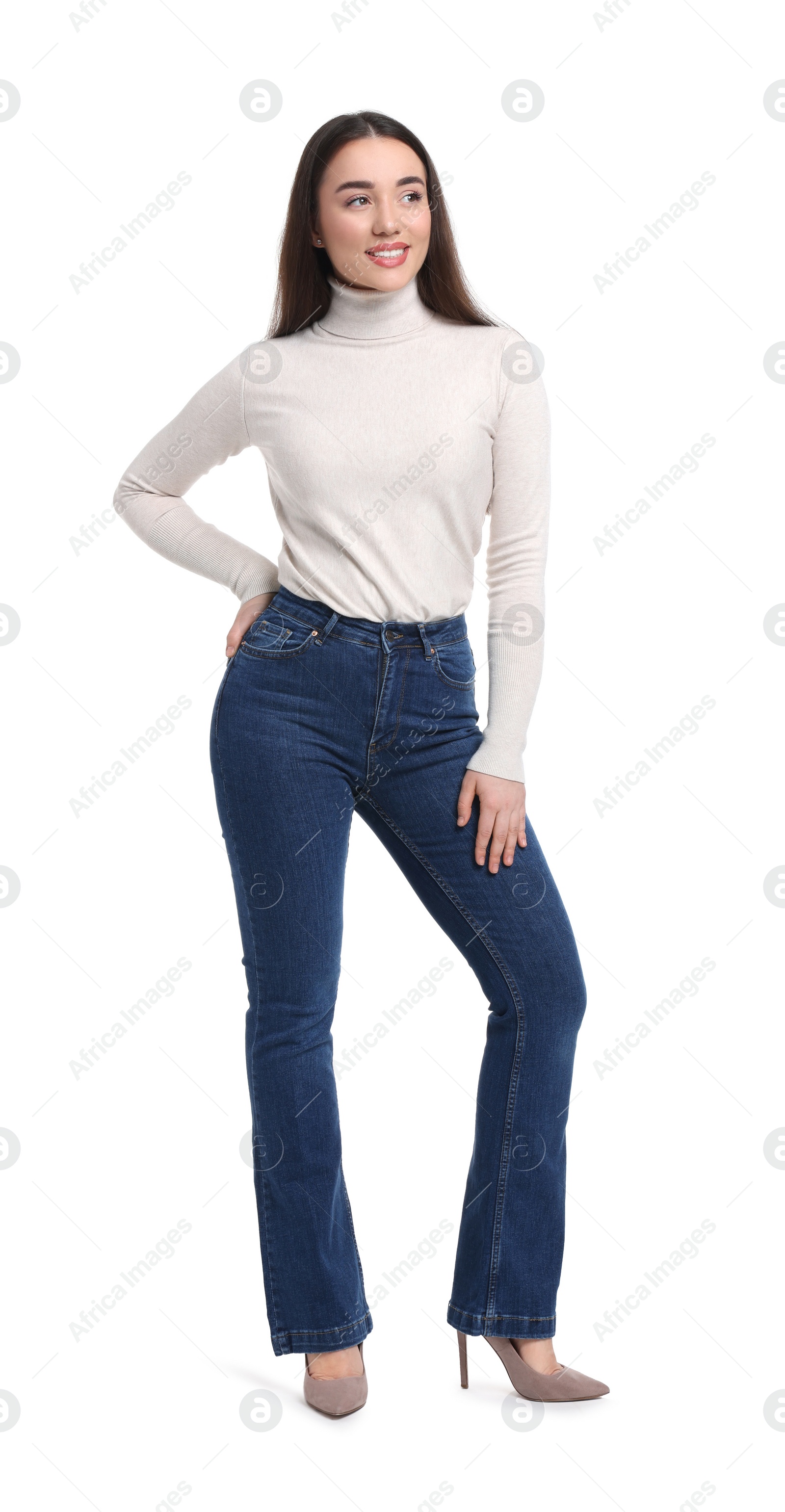 Photo of Young woman in stylish jeans on white background