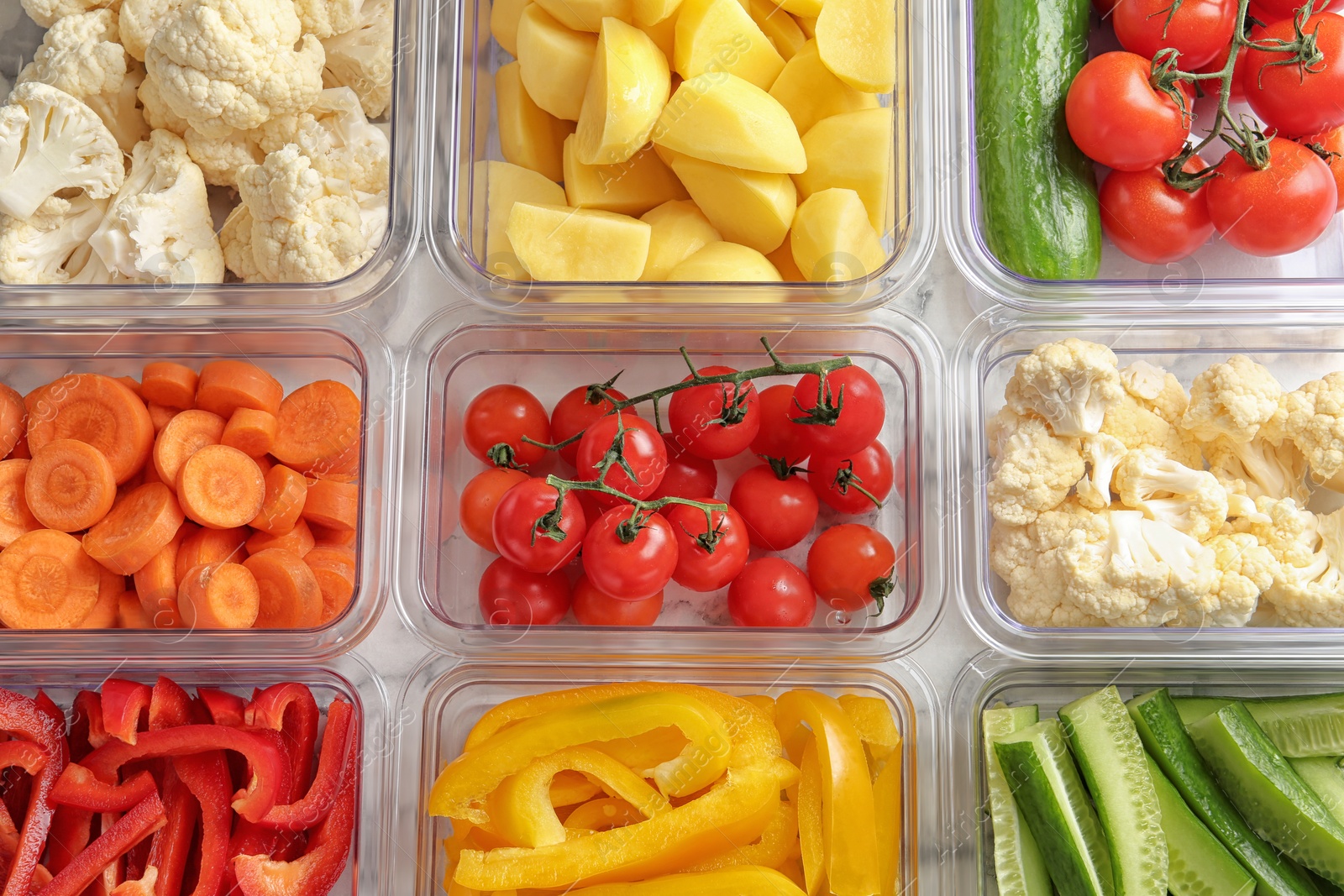 Photo of Many boxes with different raw vegetables, closeup