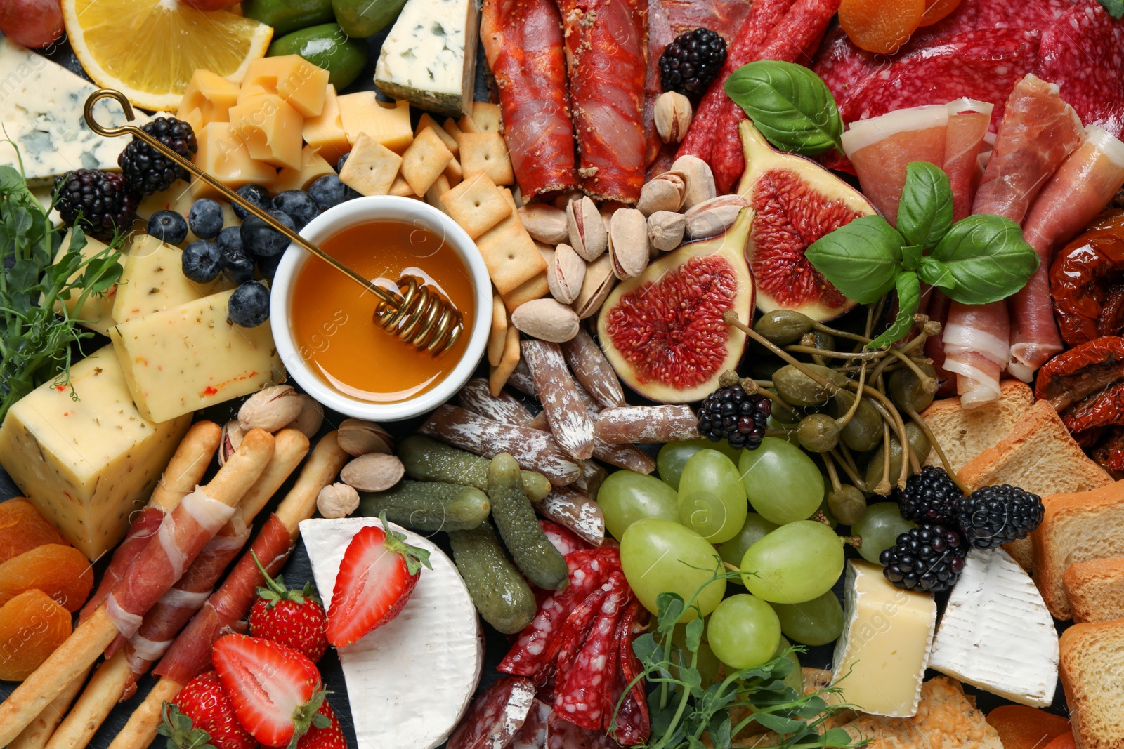 Photo of Set of different delicious appetizers as background, top view