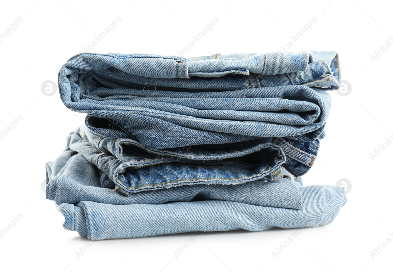 Photo of Stack of folded jeans isolated on white