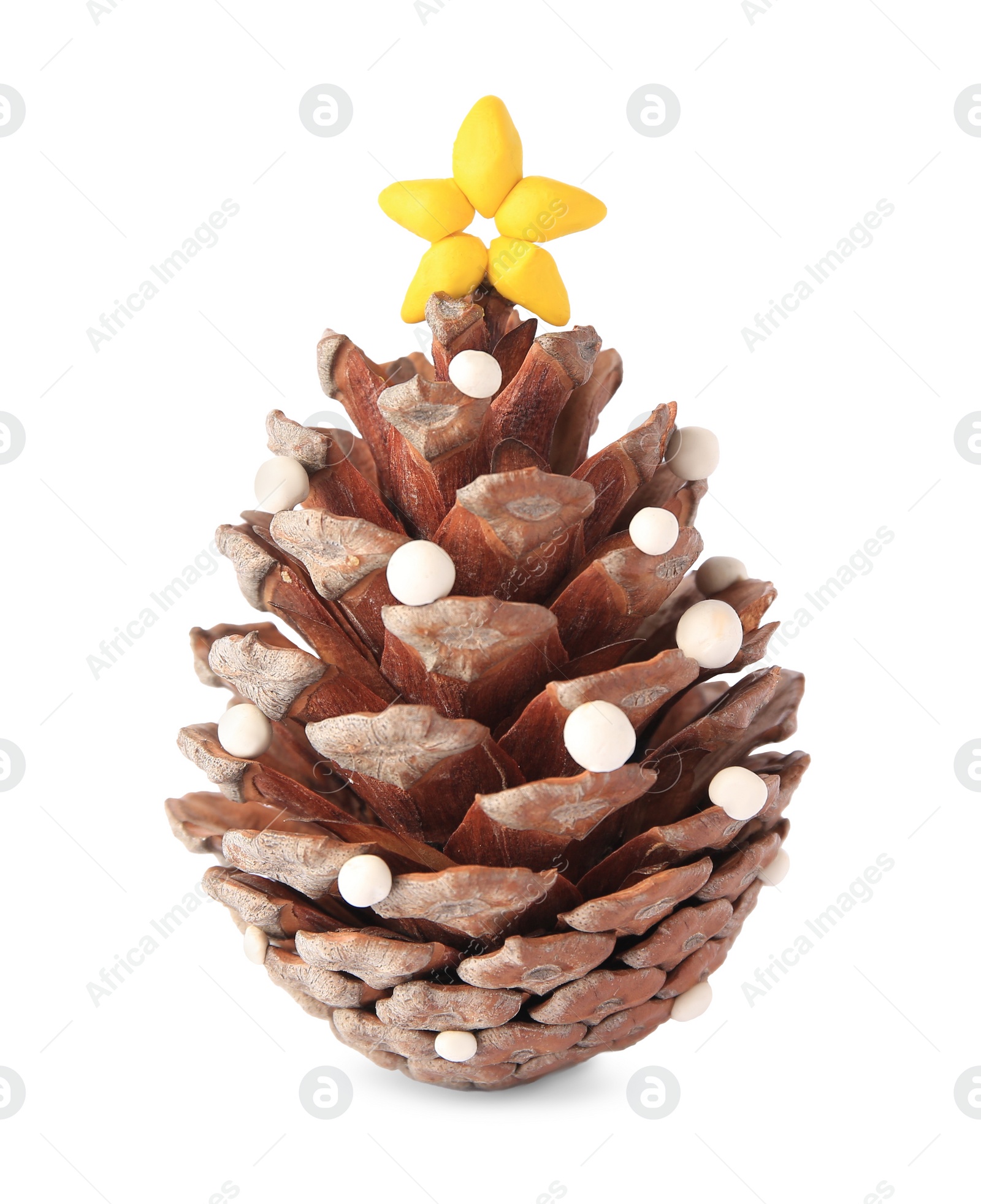 Photo of Christmas tree made from pine cone and plasticine on white background. Children's handmade ideas
