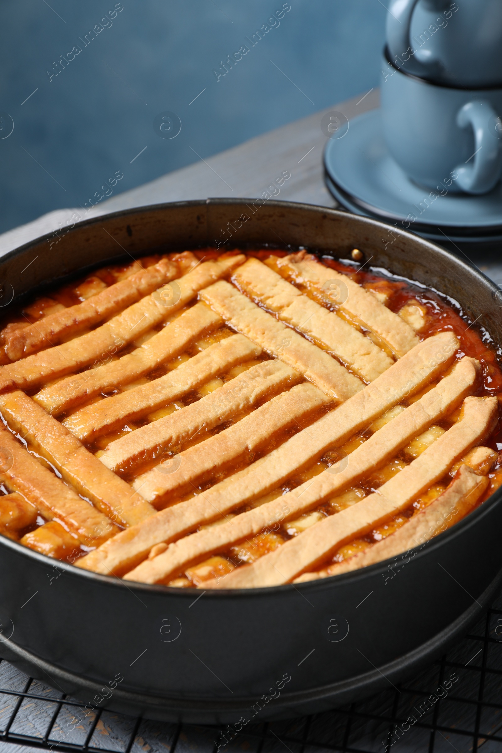 Photo of Delicious apricot pie in baking dish on table, closeup