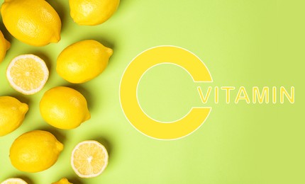 Image of Source of Vitamin C. Flat lay composition with whole and sliced lemons on green background