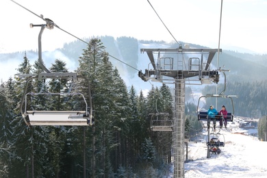 Photo of Beautiful mountain landscape with chairlift. Winter vacation