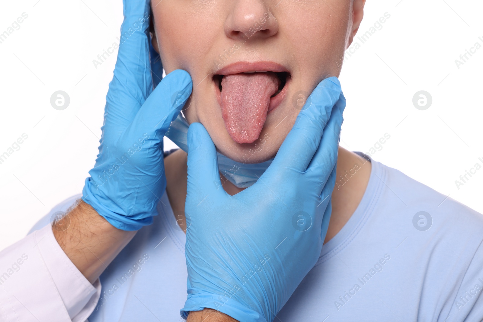 Photo of Doctor examining woman`s oral cavity on white background, closeup