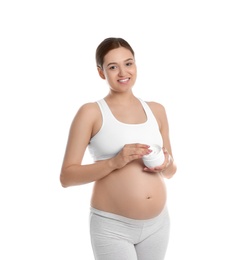 Photo of Pregnant woman holding body cream on white background