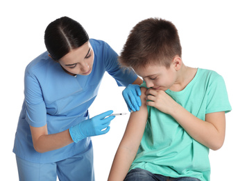 Photo of Doctor vaccinating little child on white background