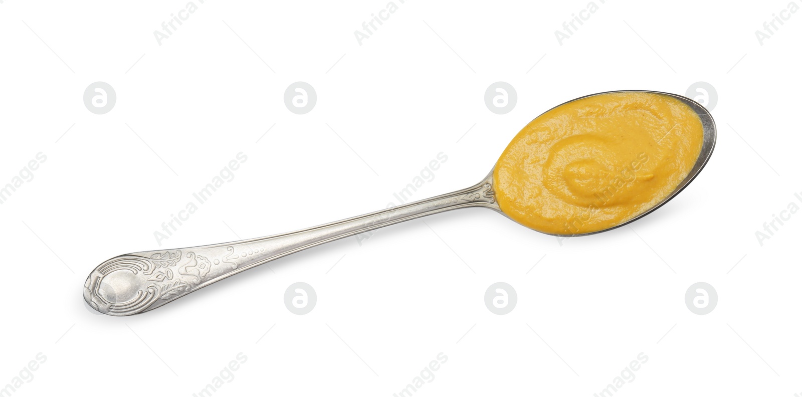 Photo of Tasty mustard sauce in spoon isolated on white, top view