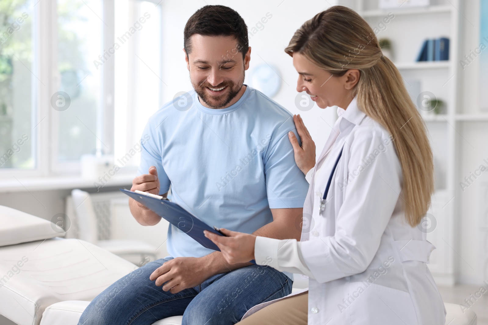 Photo of Professional doctor working with patient in hospital