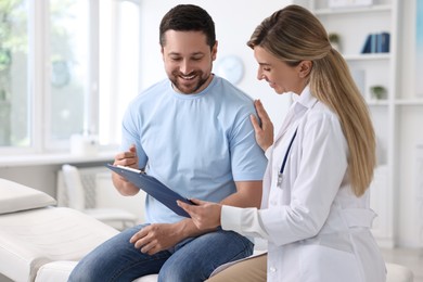 Photo of Professional doctor working with patient in hospital