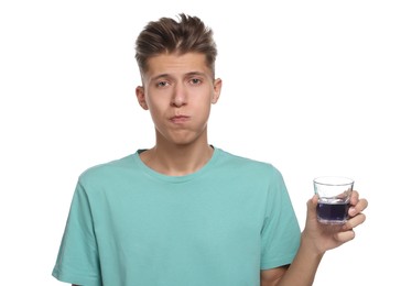 Photo of Young man using mouthwash on white background