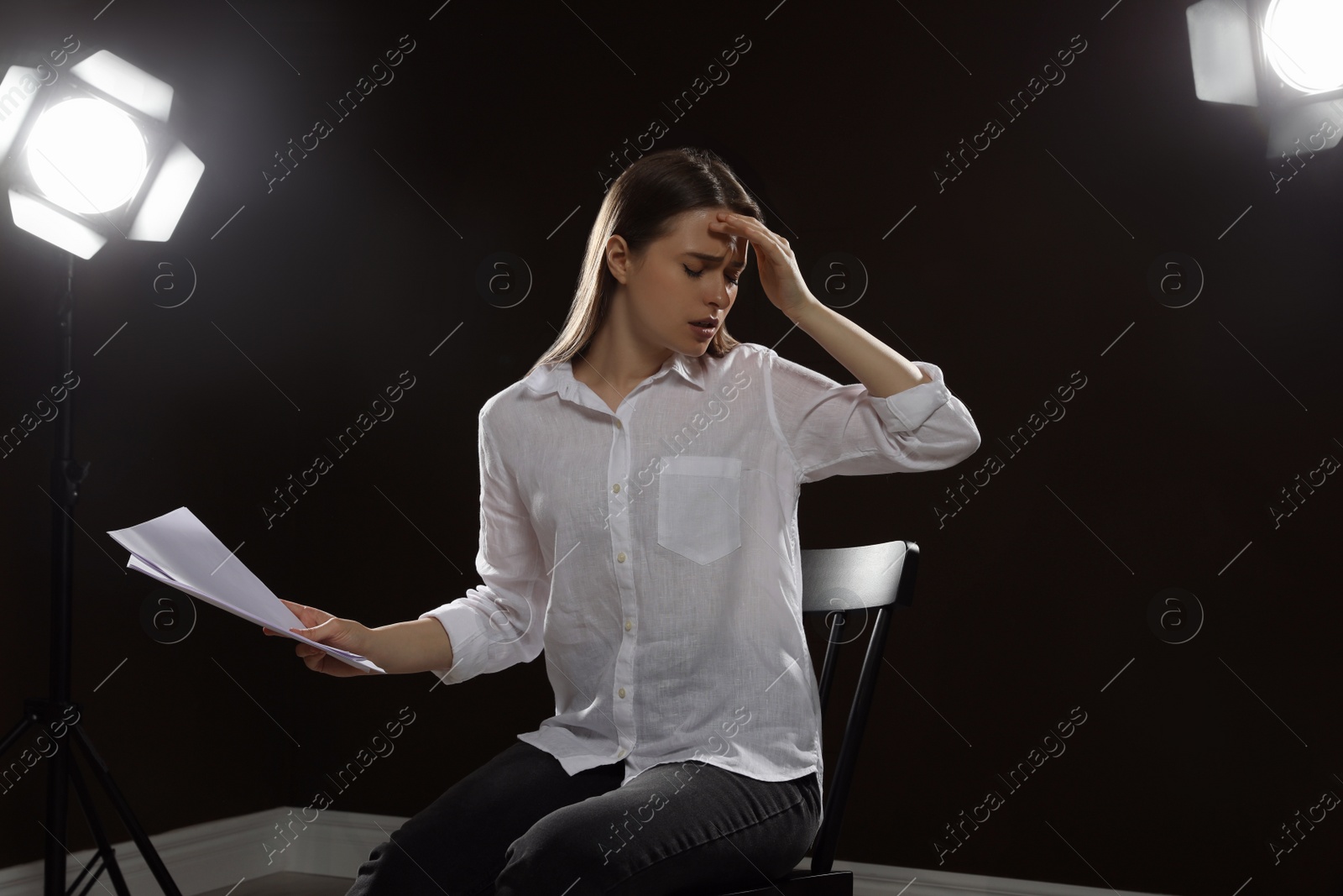 Photo of Professional actress rehearsing on stage in theatre