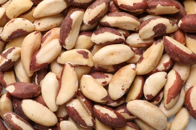 Many delicious Brazil nuts as background, top view