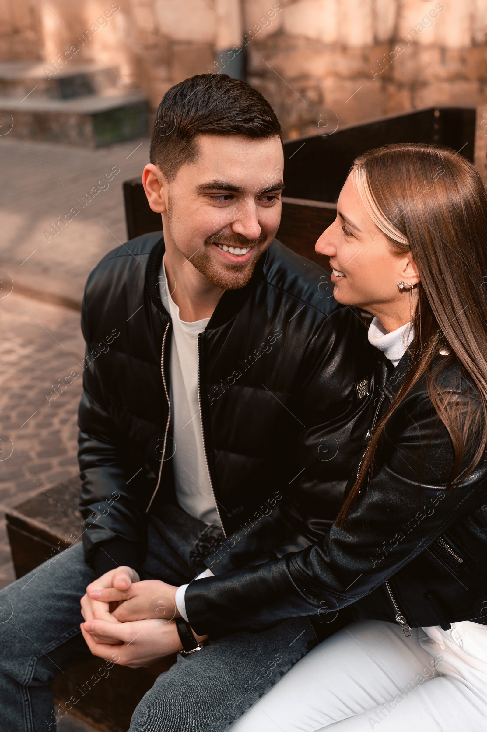 Photo of Lovely young couple enjoying time together outdoors. Romantic date