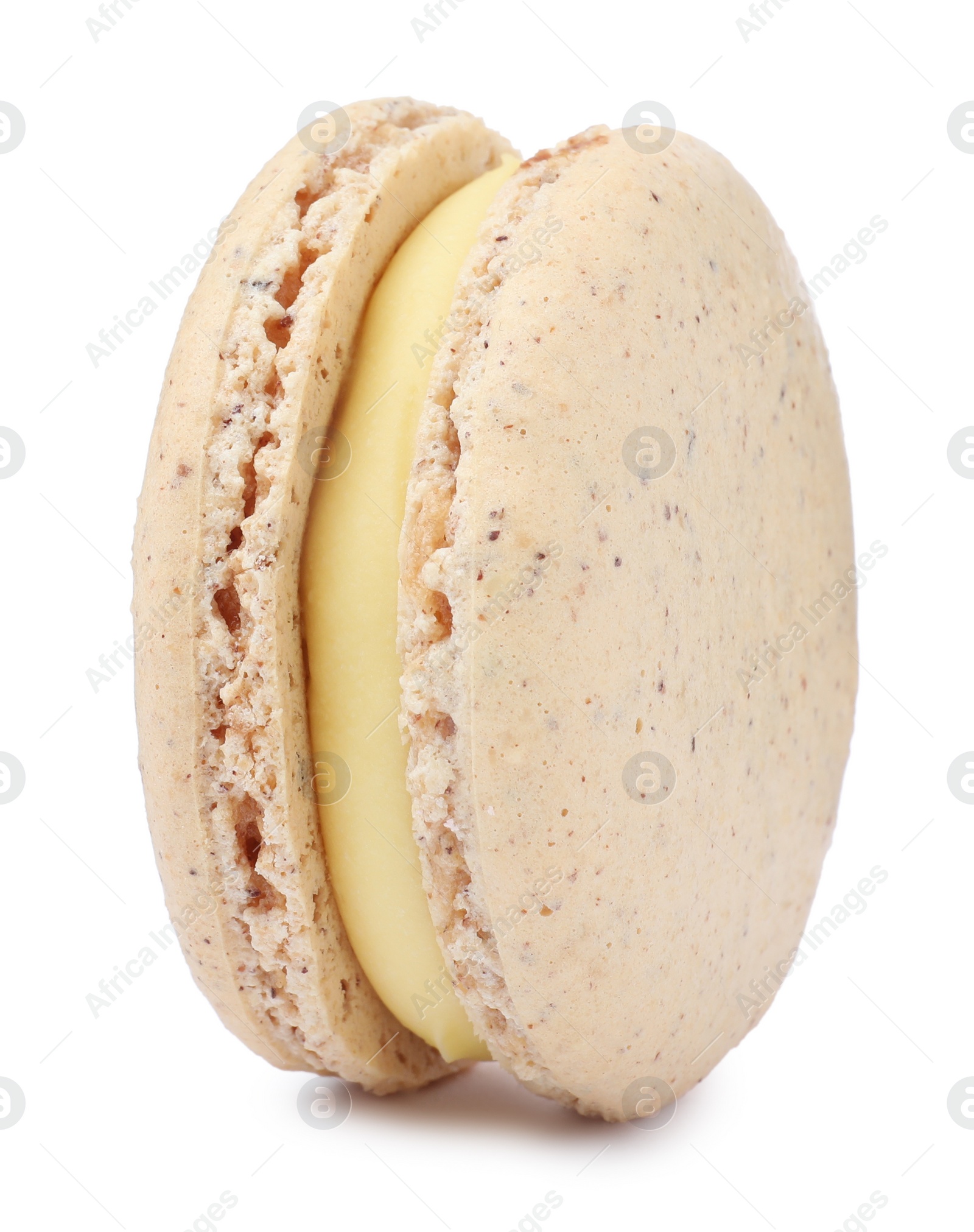 Photo of Beige macaron isolated on white. Delicious dessert