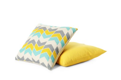 Different colorful decorative pillows on white background