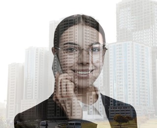 Double exposure of businesswoman talking on phone and cityscape