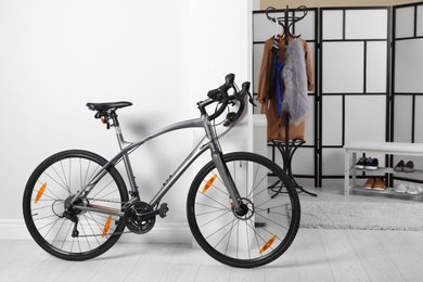 Photo of Modern apartment interior with bicycle near wall