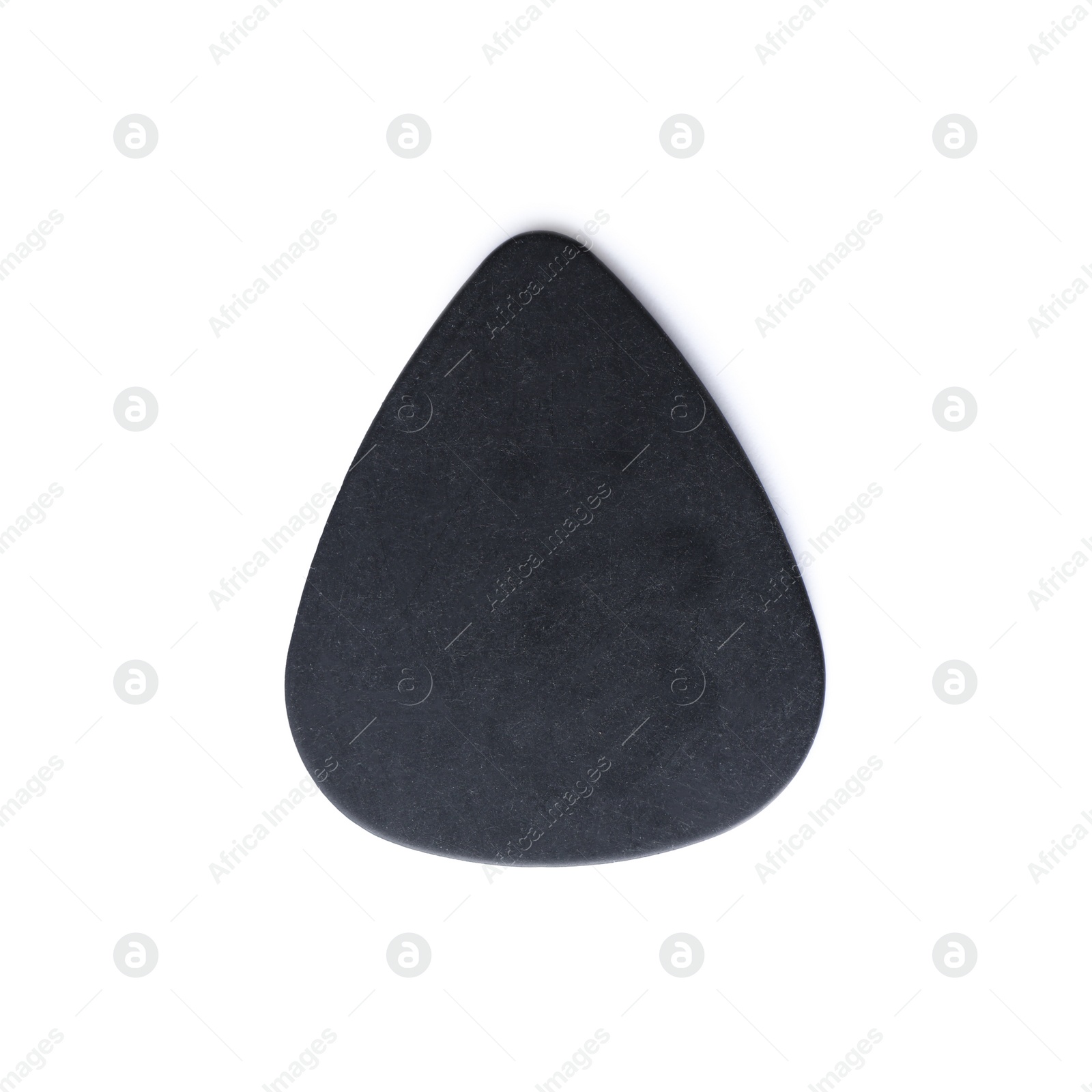 Photo of Guitar pick on white background, top view