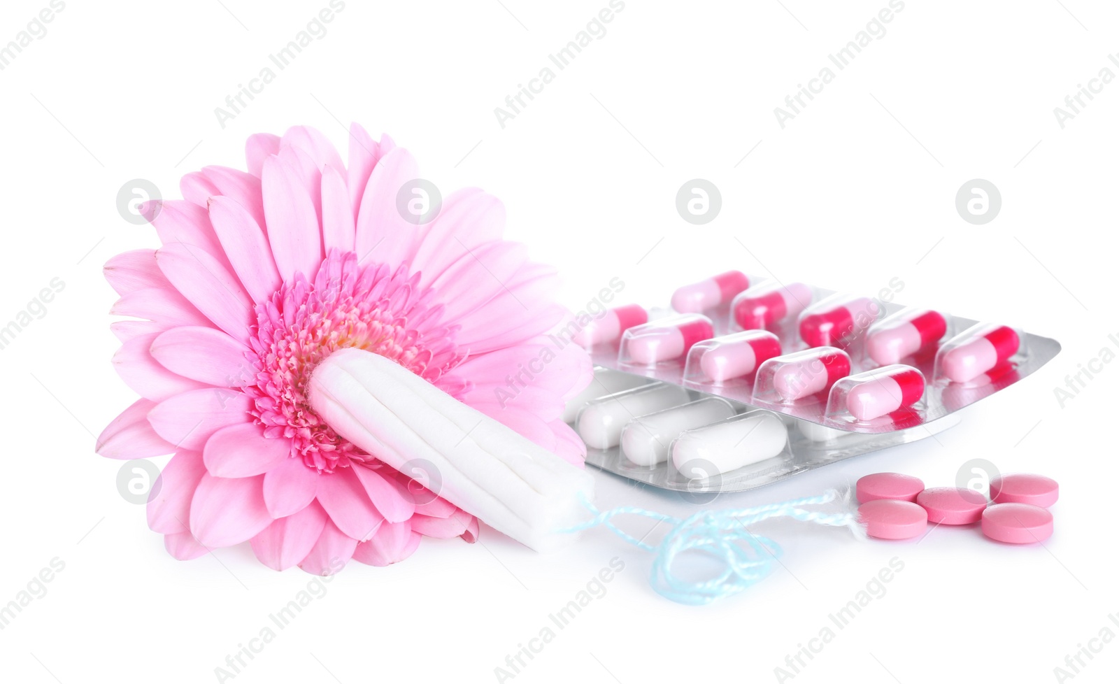 Photo of Hygienic tampons, pills and flower on white background. Gynecology concept