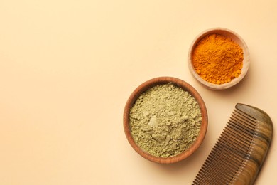 Flat lay composition with henna and turmeric powder on beige background, space for text. Natural hair coloring