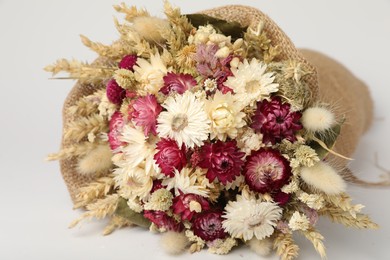 Photo of Beautiful bouquet of dry flowers on white background