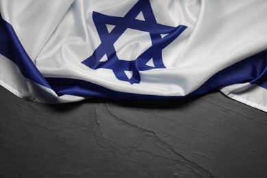 Photo of Flag of Israel on grey textured background, above view and space for text. National symbol