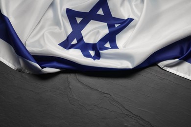 Flag of Israel on grey textured background, above view and space for text. National symbol