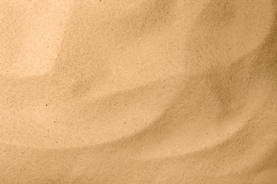 Photo of Dry beach sand as background, top view