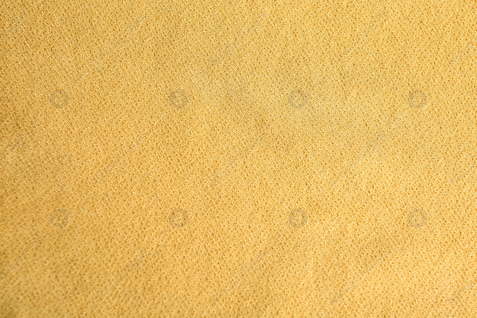 Photo of Texture of beautiful yellow fabric as background, closeup