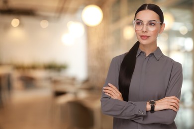 Lawyer, consultant, business owner. Confident woman with eyeglasses indoors, space for text