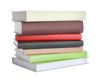 Stack of different books on white background
